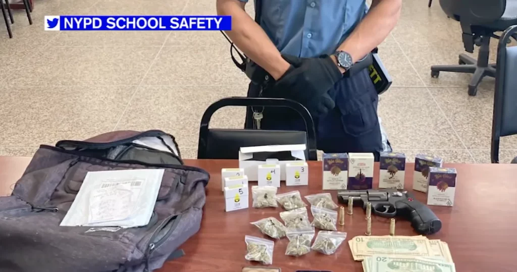 School Safety Agent with guns, money, and drugs seized from student